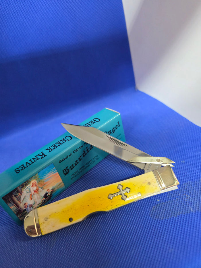 Guardian Angel Lock Back Cheetah Knife Yellow Bone Handles 4 3/8" EM2567052YBN