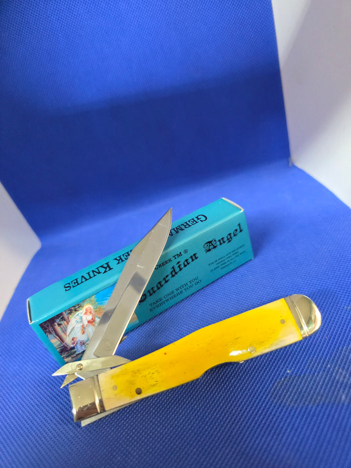 Guardian Angel Lock Back Cheetah Knife Yellow Bone Handles 4 3/8" EM2567052YBN